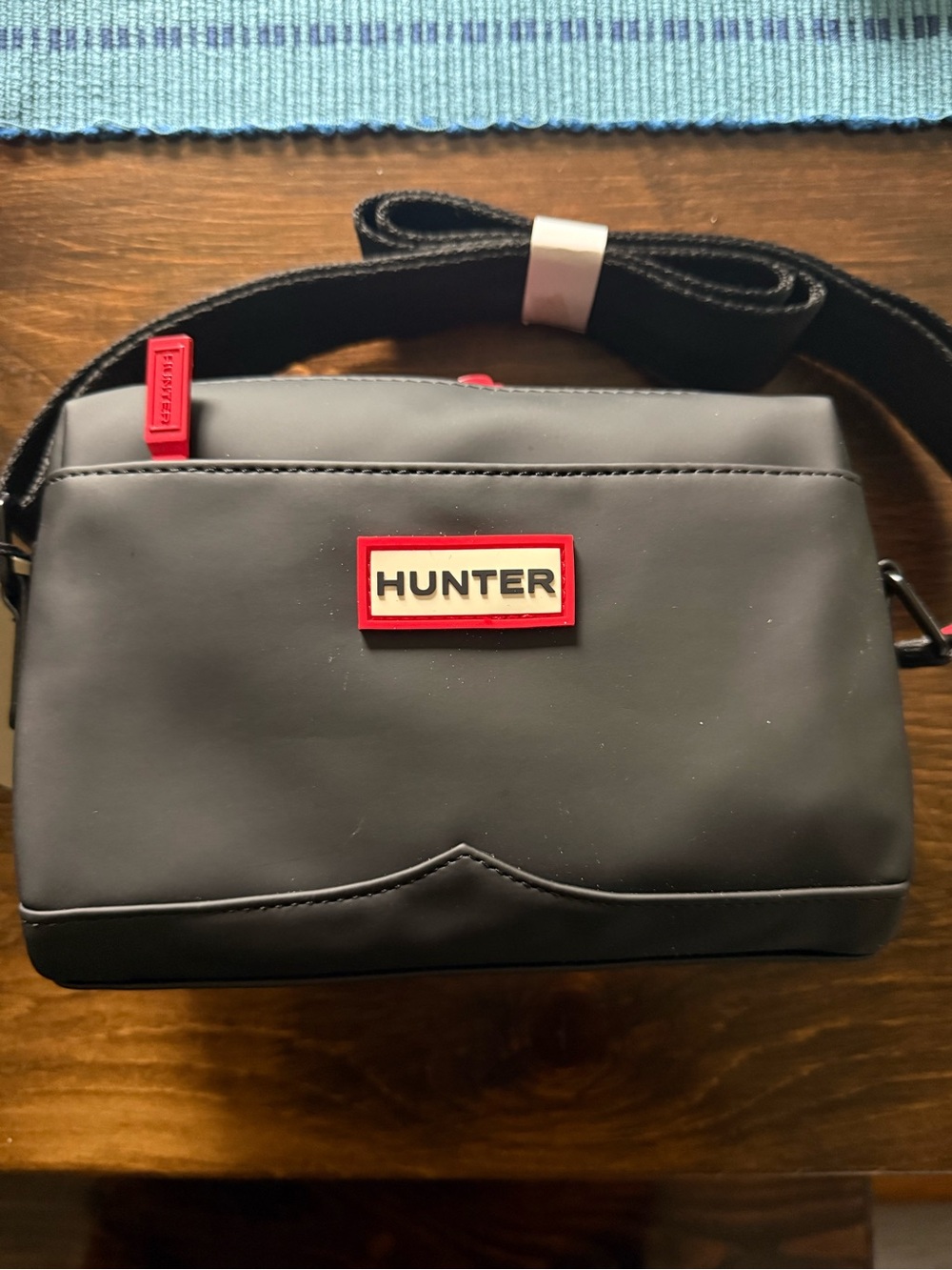 Hunter Black Crossbody with Red Trim and Logo